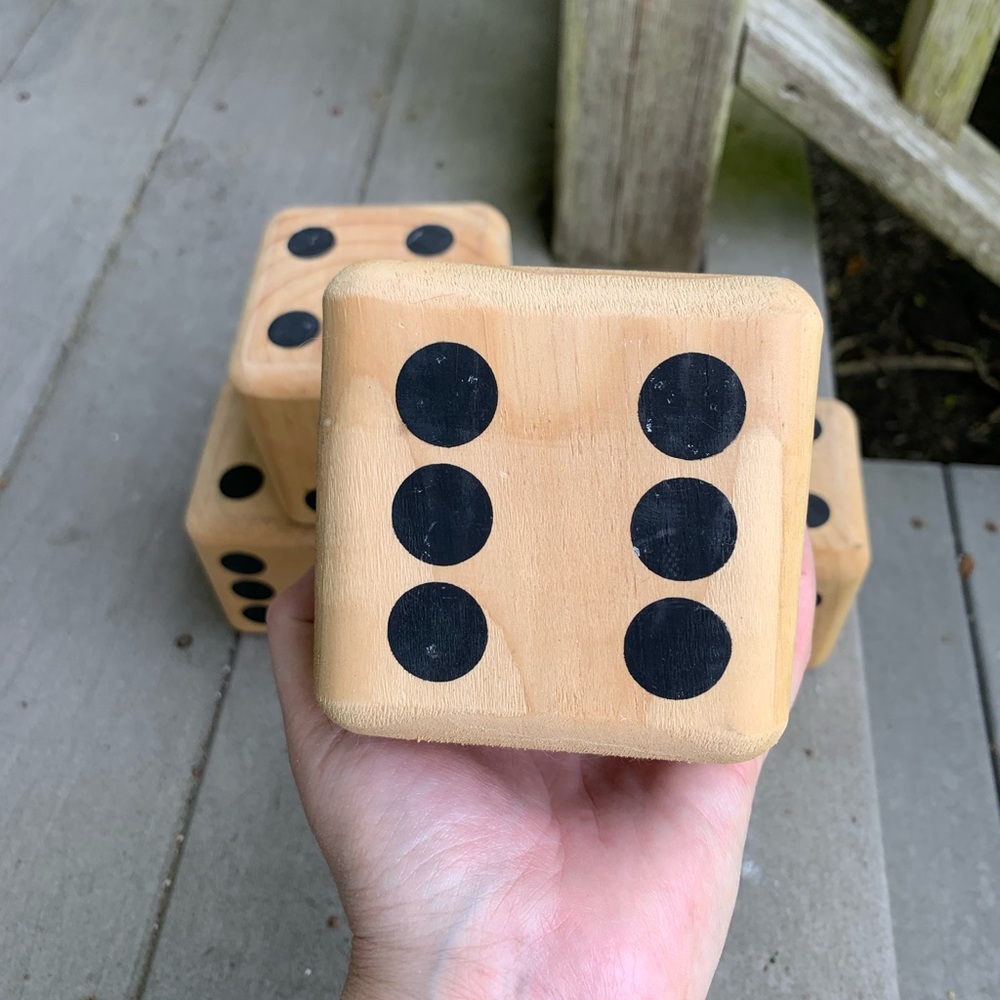 5 wooden block dice.